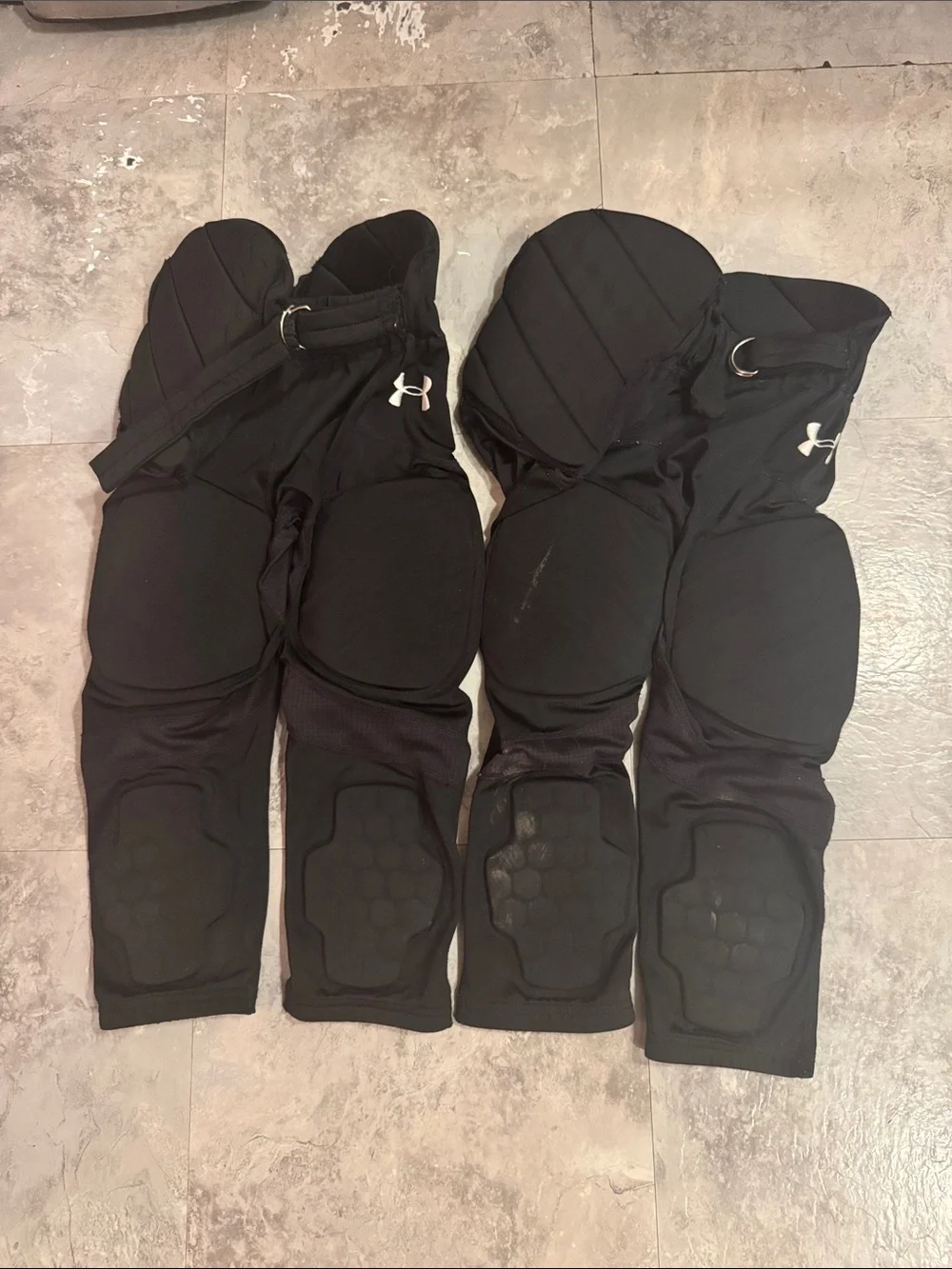 Under Armour youth, small padded, black football pants